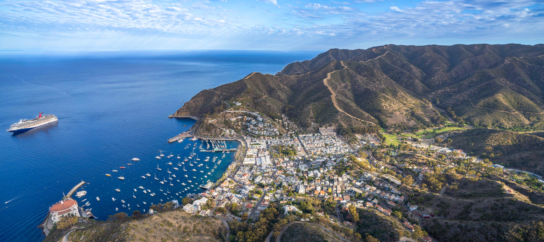 Views of Avalon Harbor and Catalina Island coastline from above with Maverick Helicopters