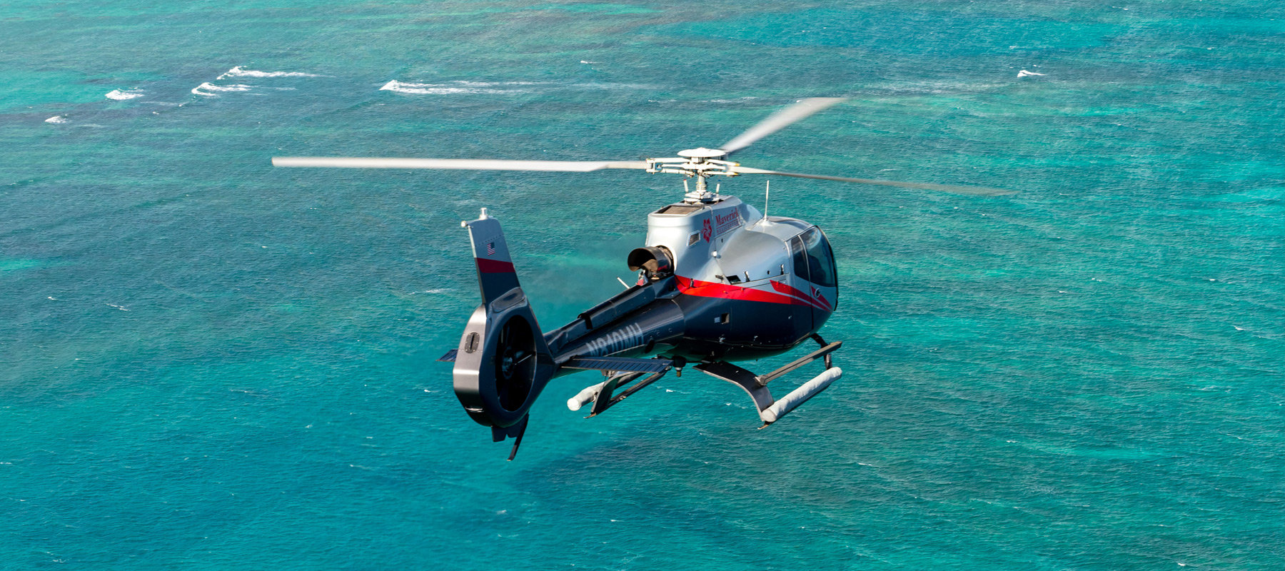 Flying over turquoise waters along the Molokai coast