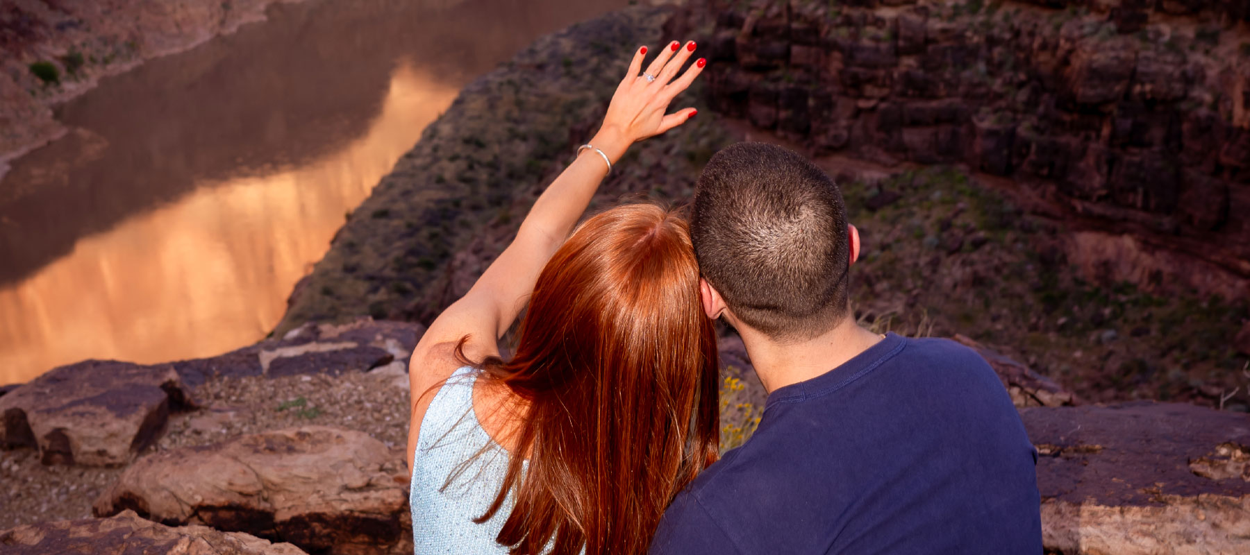 An intimate embrace after a surprise Grand Canyon helicopter marriage proposal