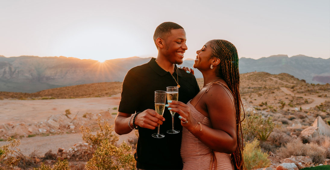 Intimate helicopter proposal: Couple enjoying panoramic Las Vegas views and champagne toast