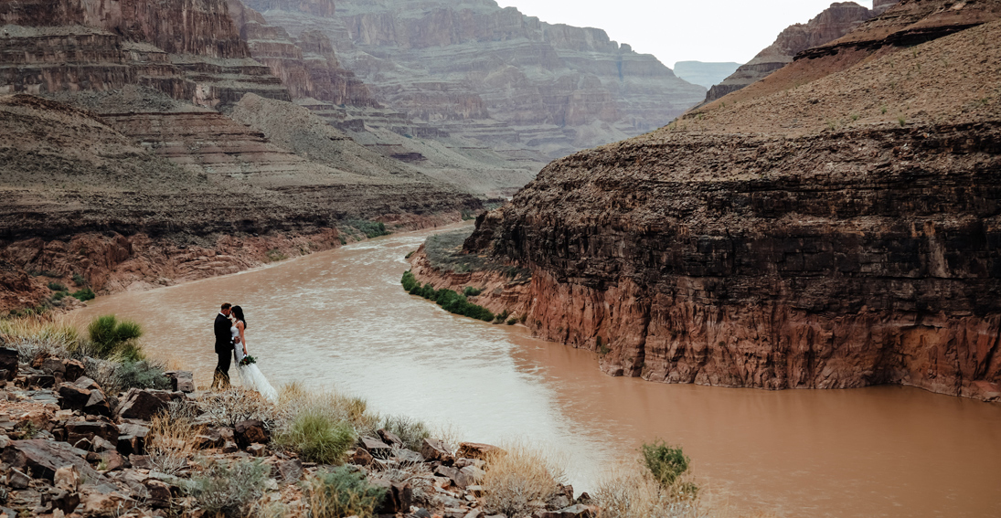 Bride and groom sharing their love during a destination wedding in the heart of the Grand Canyon