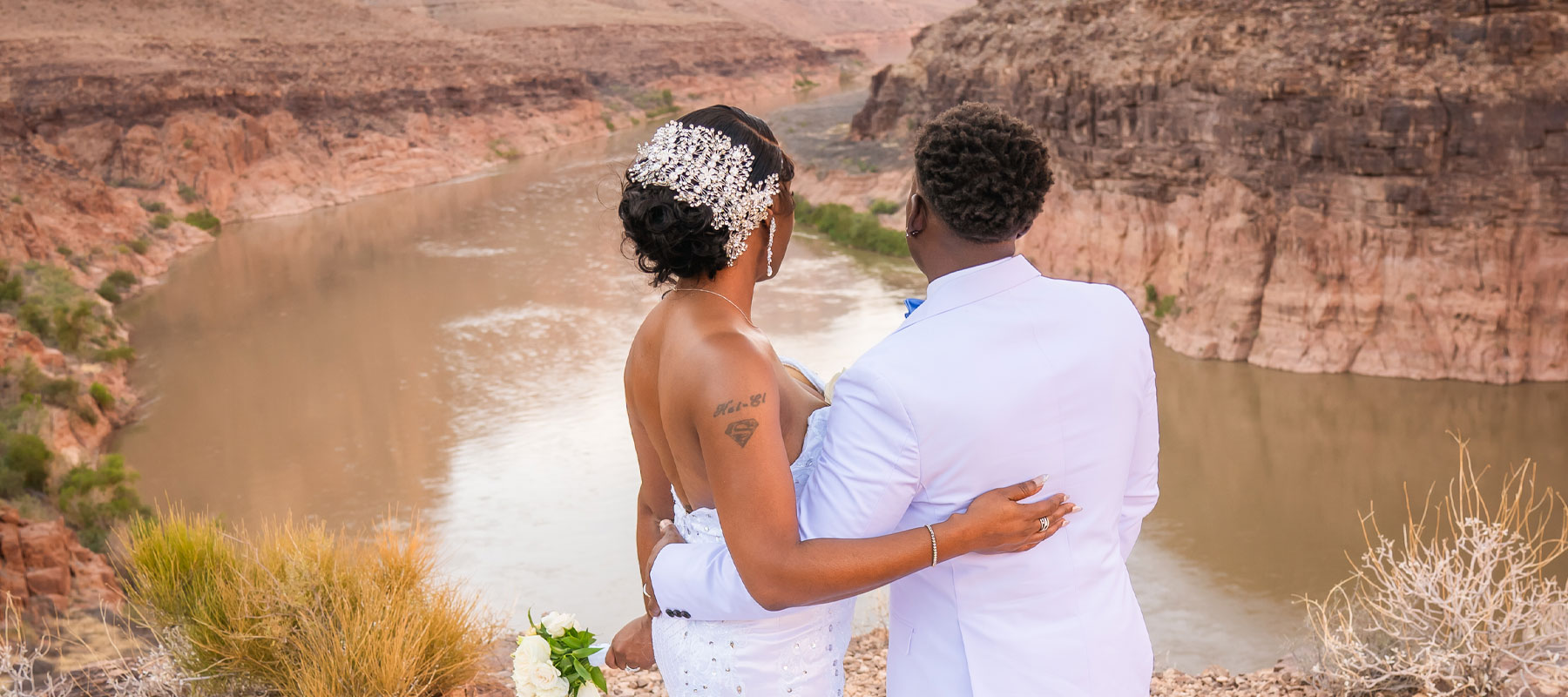 Wedding couple taking in the panoramic views deep inside the Grand Canyon