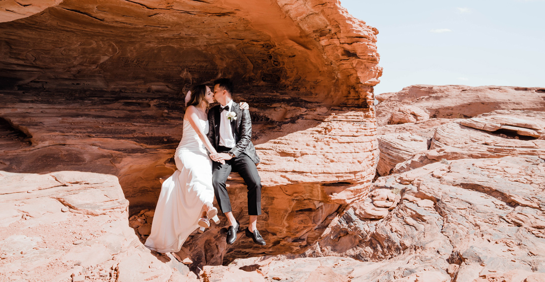 Bride and groom sealing their vows with a kiss at Valley of Fire