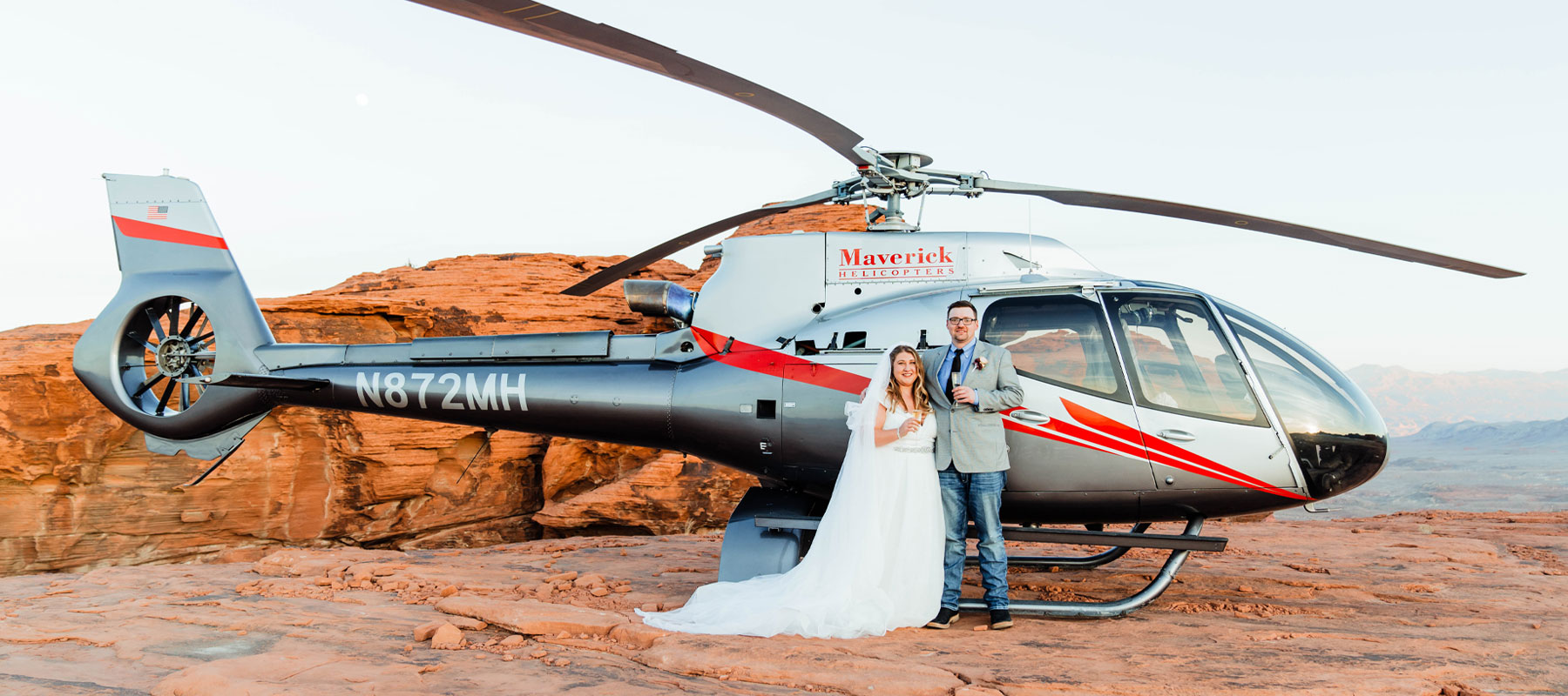 Maverick helicopter at a private Grand Canyon landing site for a sunset wedding experience